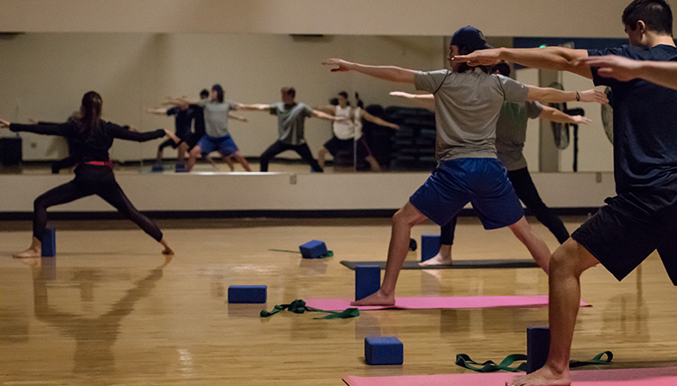 GU students participating in a yoga class