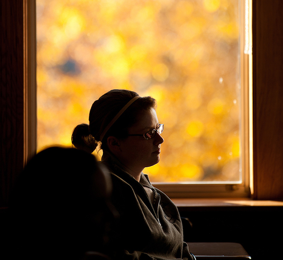 A student listens to a lecture from Psychology Professor Monica Bartlett.