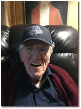 Charlie O'Connor smiling with a Gonzaga hat on