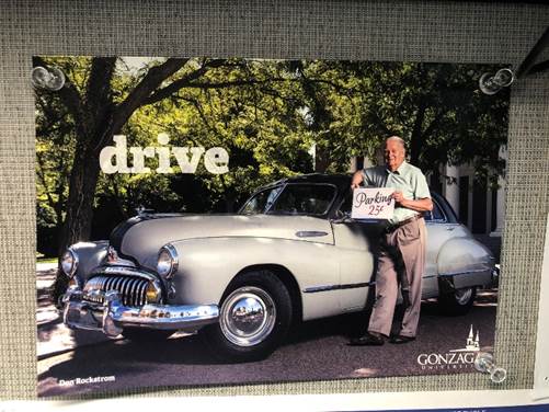 Picture of Don in front of a classic car with the word Drive at the top