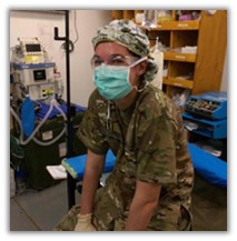 Captain Meaghan Mug sitting in a medical room in uniform