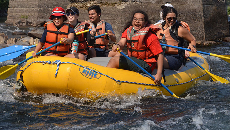 Students rafting down a river.