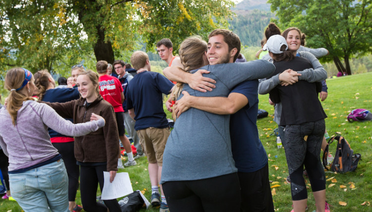 students share hugs and smiles as they are on retreat