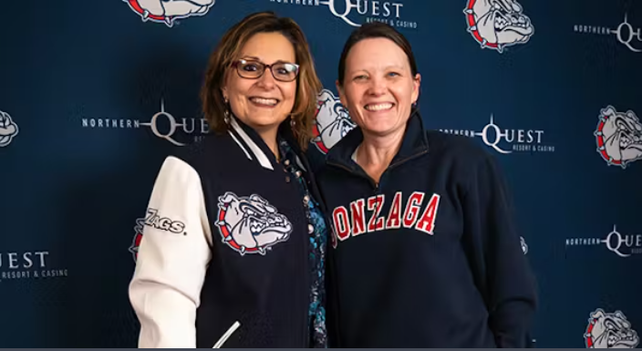 President Passerini poses with Professor Peggy Sue Loroz at the premiere of "The Slipper Still Fits"