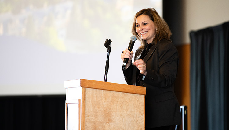 Woman speaking on stage