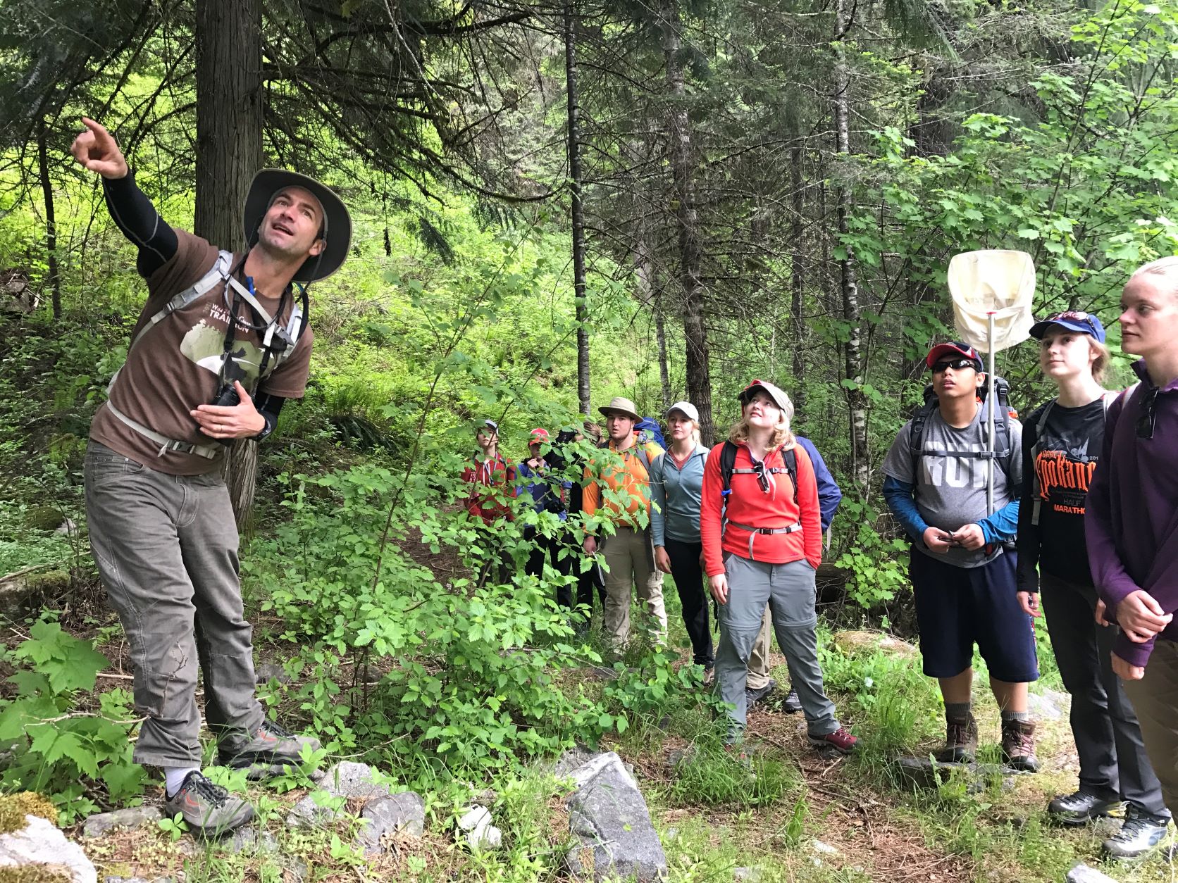 faculty with students outdoors