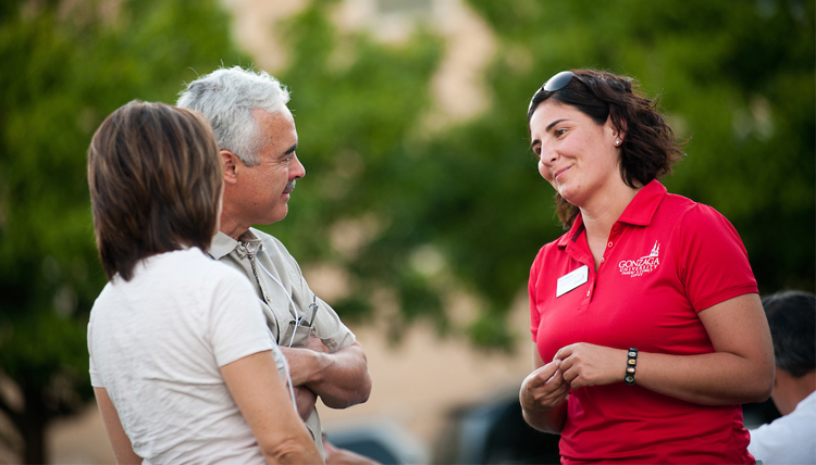 Parents speaking with a faculty member.