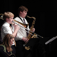 Trombone and saxophone students practicing.