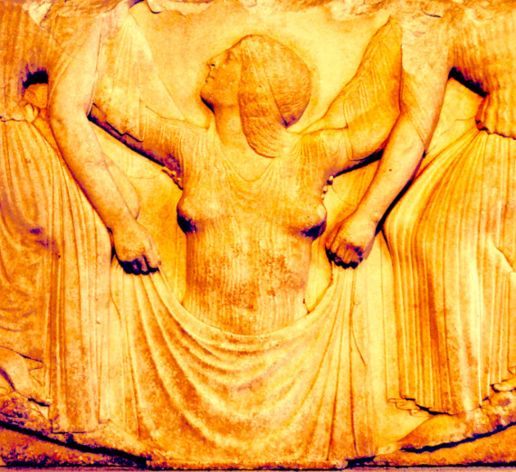 stone carving of a women reaching up and looking to the left