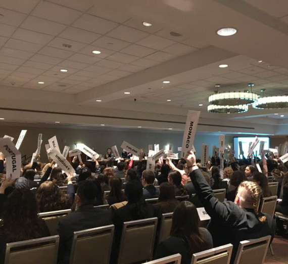 Students holding placards at a Model United Nations Conference