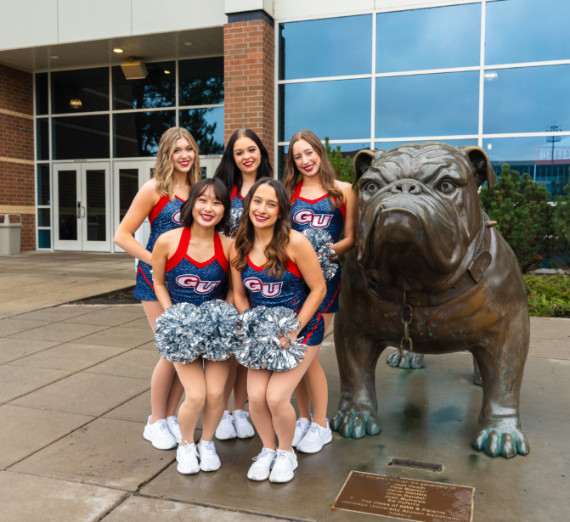 Five dancers with Spike outside of McCarthey Athletic Center