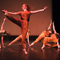 Dancers performing on the Magnuson Theatre stage.