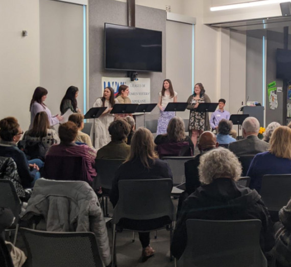 Gonzaga Theatre students performaing for an audience at a meeting of the League of Women Voters of Spokane.