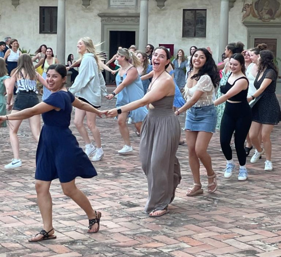 Students dancing in a courtyard in Florence.