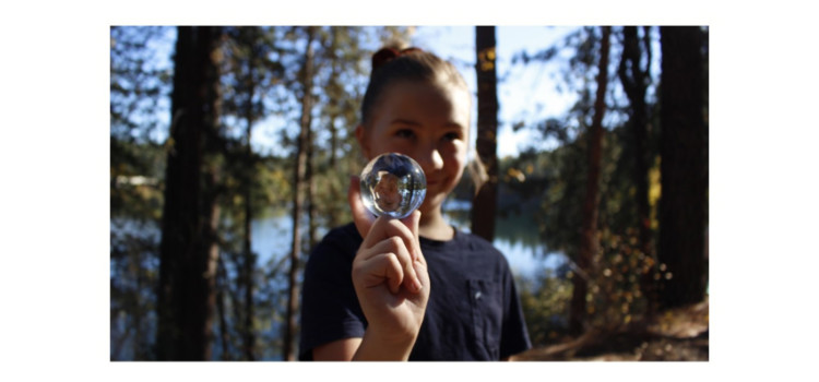 Photo of a person holding a bubble