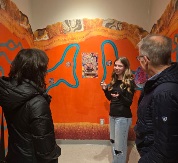 Ava Knap, Gonzaga University neuroscience major, explains her interdisciplinary art installation at the Shoebox Gallery inside the Jundt Art Museum.