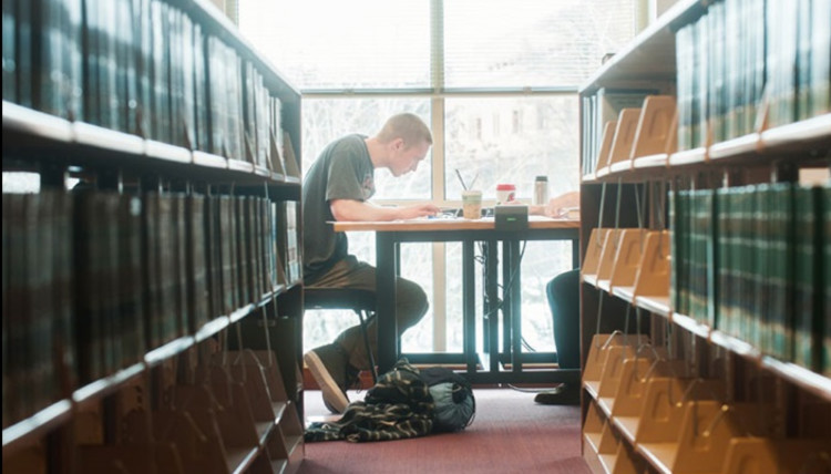 A gonzaga University student studying in Foley Library.