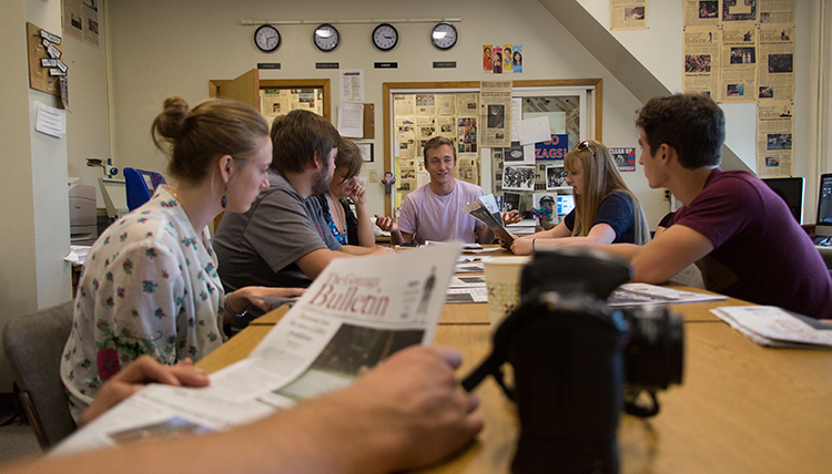 Gonzaga University Integrated Media Journalism Students around a table