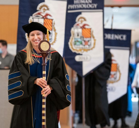 Marianne Poxleitner carrying ceremonial mace at the Academic Honors Convocation. Photo Credit Zack Berlat, Gonzaga University Photographer.