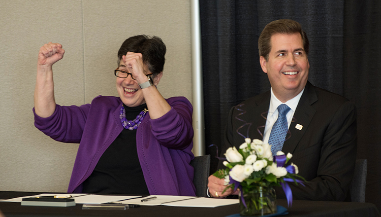 Gonzaga President Thayne McCulloh and University of Washington President Ana Mari Cauce celebrate after signing a new partnership agreement for medical education and research between the two schools.