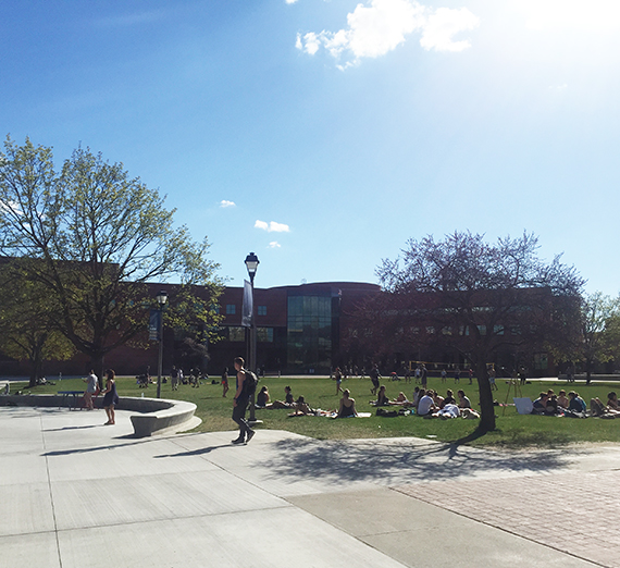 Foley in spring with students outside enjoying the sun
