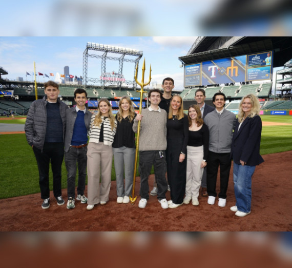 Student group photo on baseball field 