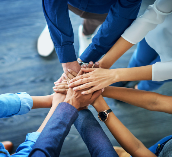 Hands stacked on top of each other