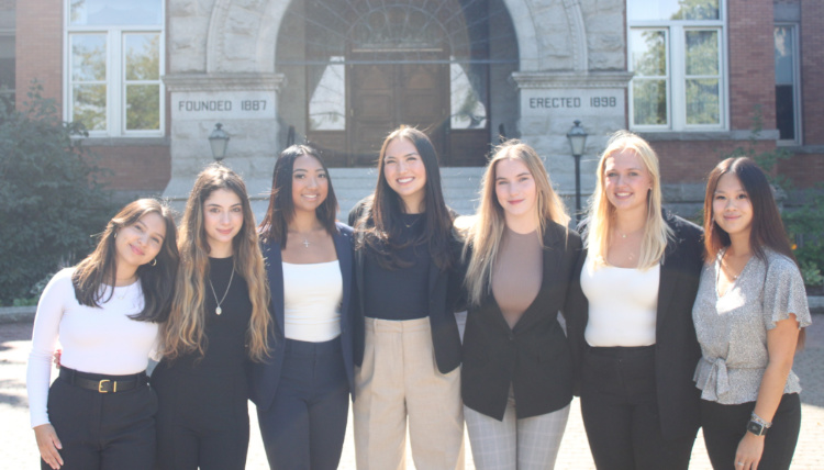 The Women in Business students in front of College Hall 