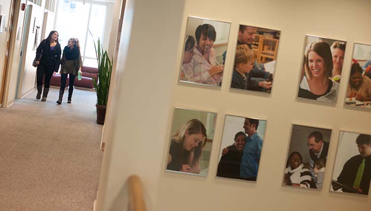 Creative photo of a wall of photos in a building.