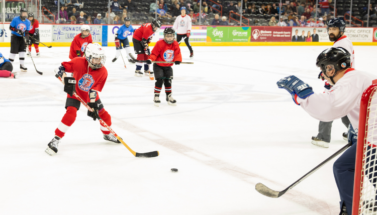 Students play ice hockey