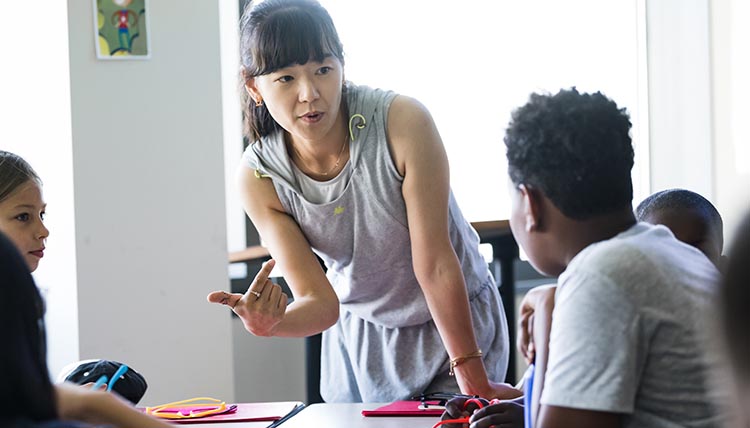 Teacher talking with students