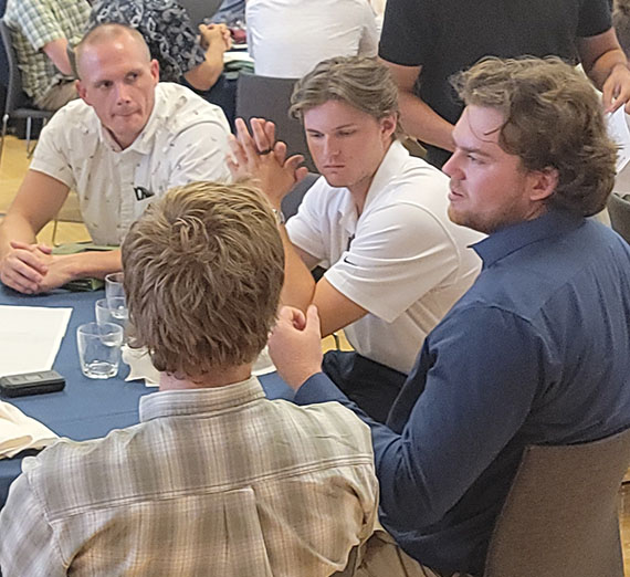 Conversation at table in Hemmingson Ballroom