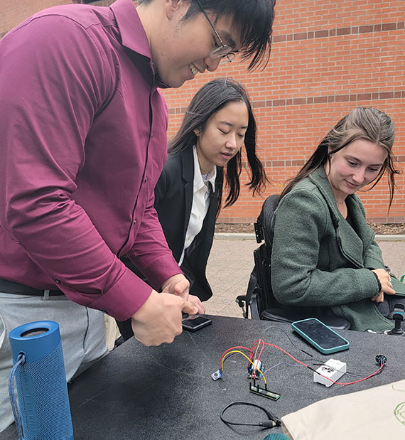 student team adjusts their prototype