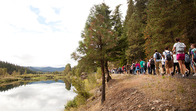 Students hiking along Spokane river
