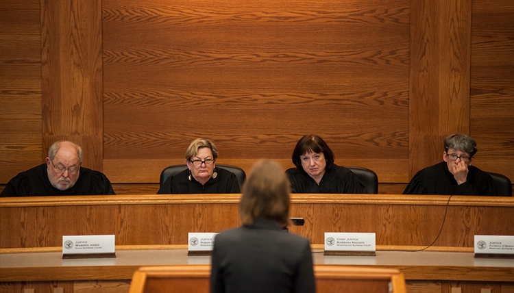 Student facing judges in courtroom