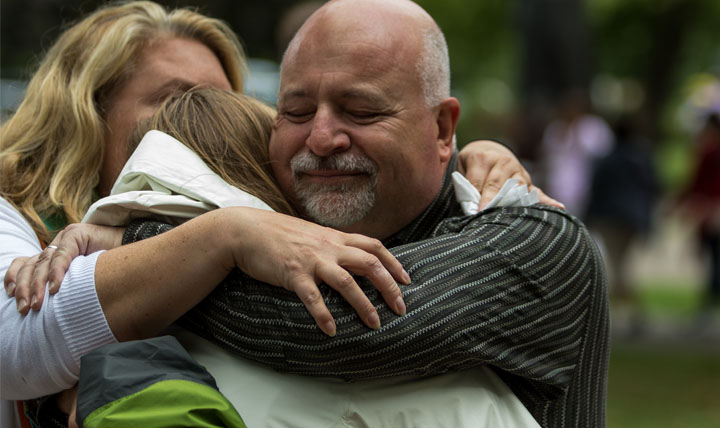 parents hug student 