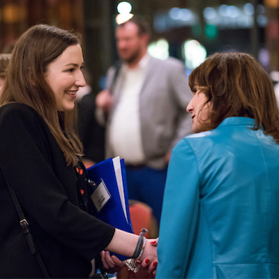 student and employer conversing at a Trek networking event