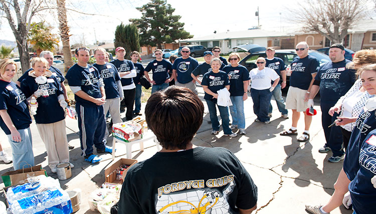 Volunteers gather to talk about their day of giving