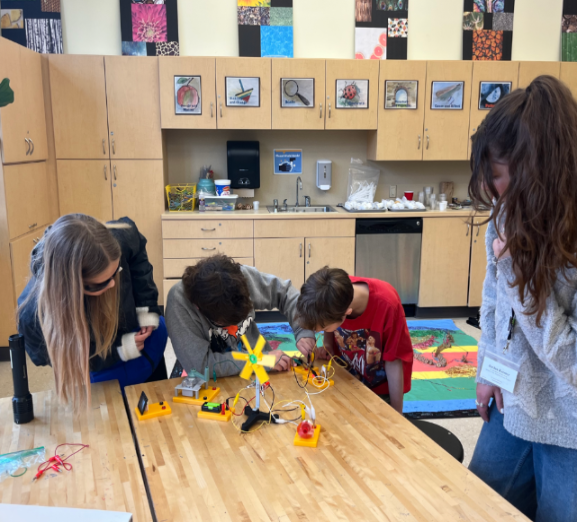 Students in a classroom learn about renewable energy