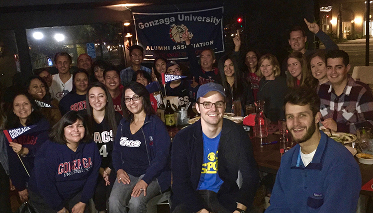 a group of LA gonzaga alumni gather at a bar to watch the Zags