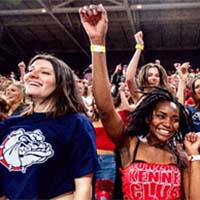 Two Gonzaga students cheering in a crowd.