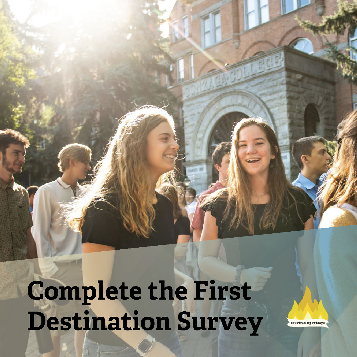 Several students walk past the front of College Hall. The sun shines brightly between the pine trees and the two women closest to the camera smile into the lens. Underneath the photo, text reads: 'Complete the First Destination Survey.'