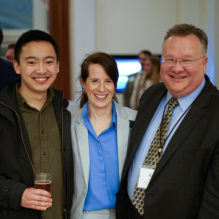 Gonzaga alumni Xavier stands next to two Career & Professional Development team members (Vicki Hucke and Ray Angle) for a photo at the Bay Area networking social.