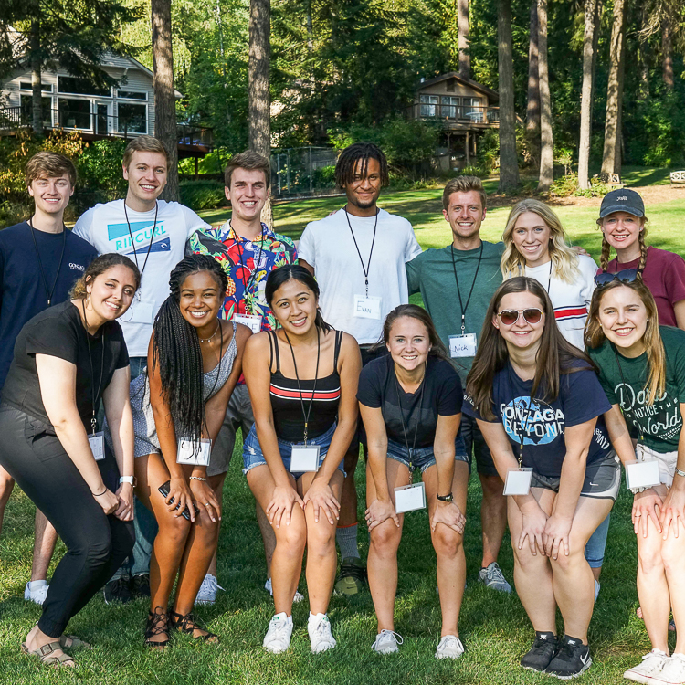 The 2019 Pro Rep Team (13 members) pose together outside during their Pro Rep team retreat.