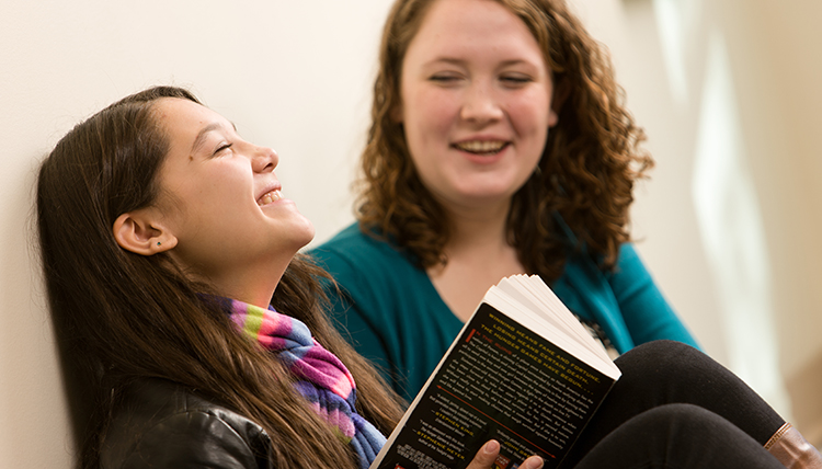 Two female students smiling.