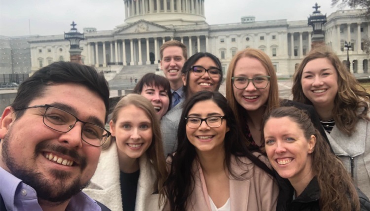 Gonzaga students smiling in front of the Capital Building in Washington D.C.