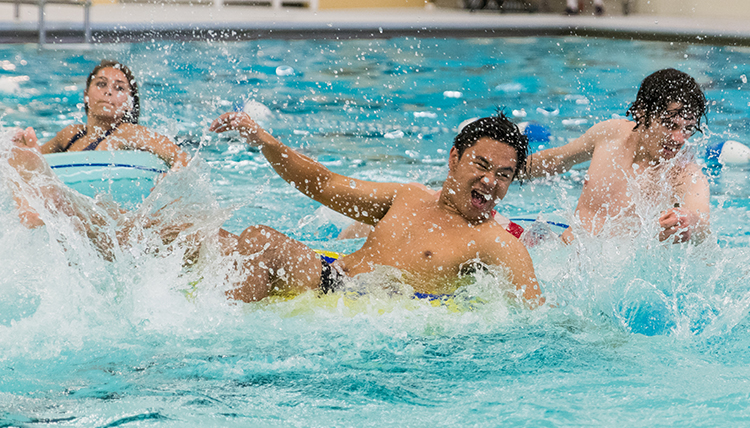 Gonzaga students plays inner tube basketball in the pool