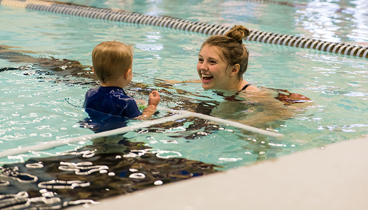 GU student swim instructor teaching swim lessons in the RFC pool