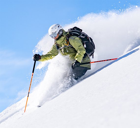 A person skiing down a slope.