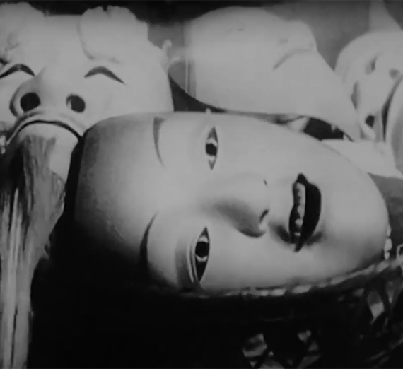 A black and white image of Japanese masks.